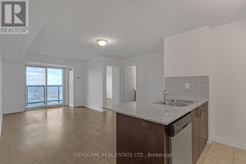 A kitchen area with a sink and a dishwasher.