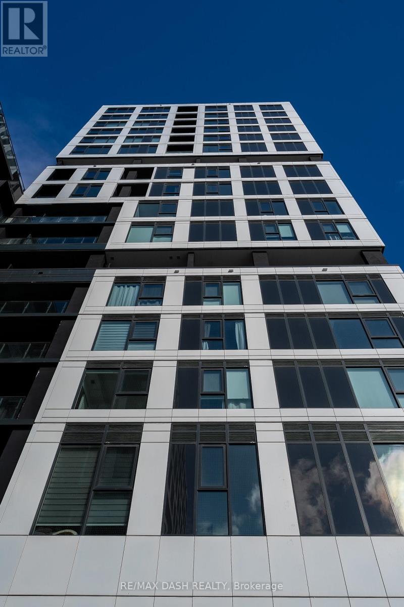 A tall building with many windows is shown in the image.