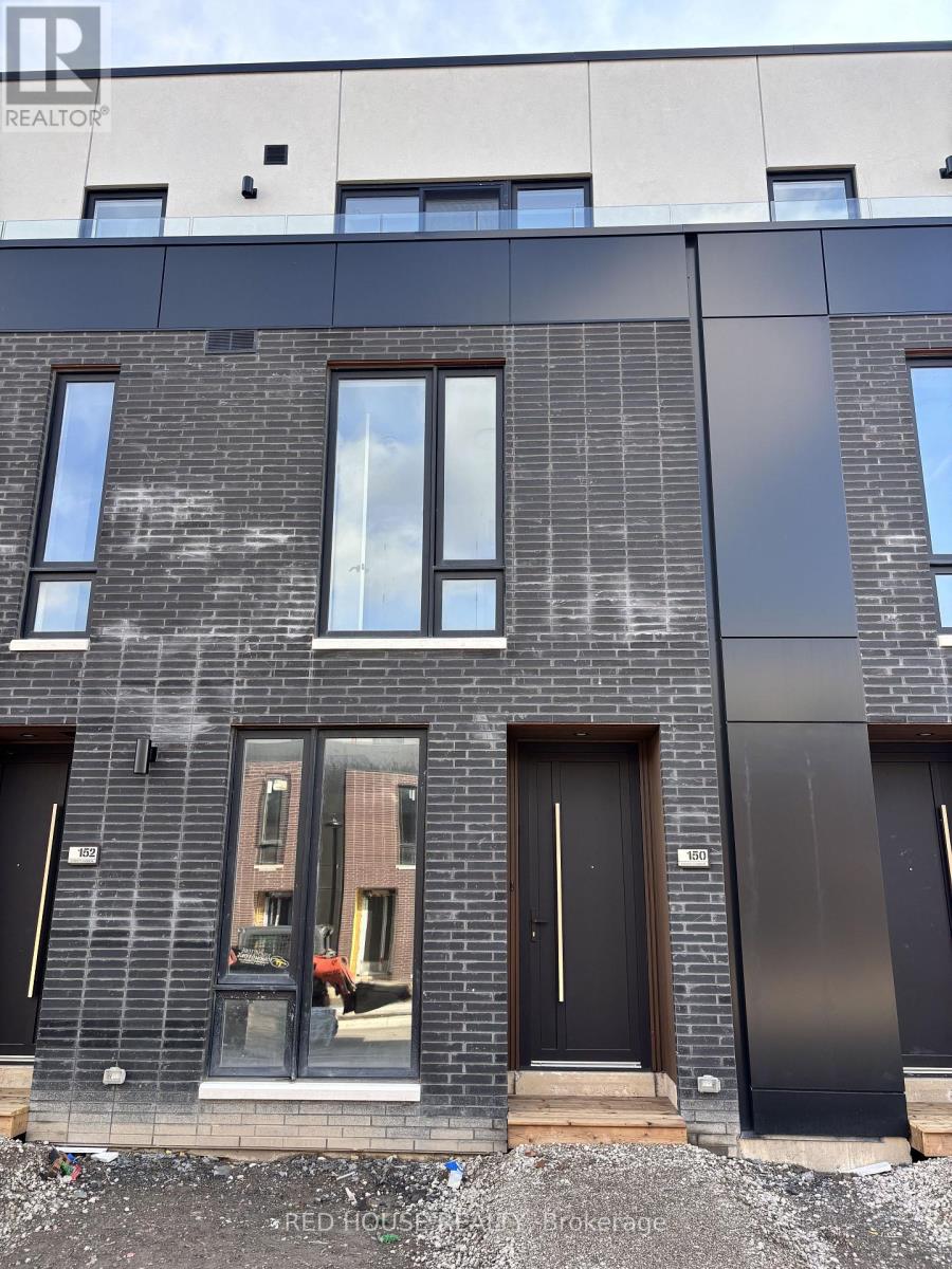 A modern building with a black door and windows.