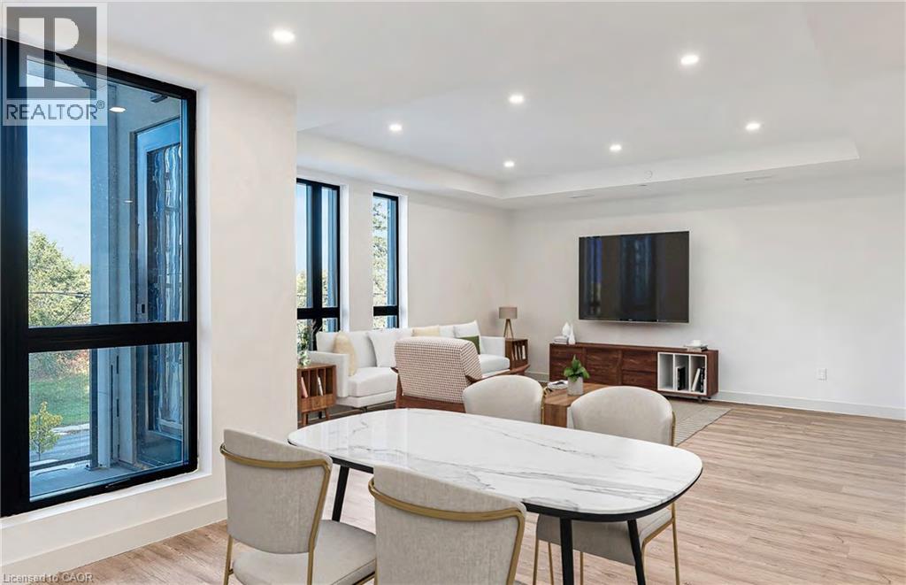 A modern dining room with a glass door and a white table.