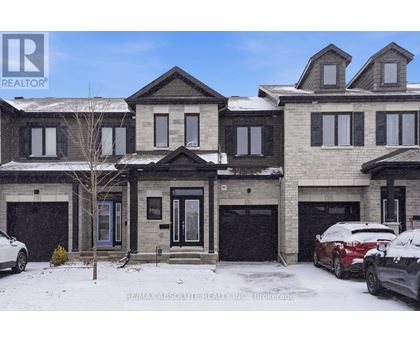 A large house with a car parked in front of it.