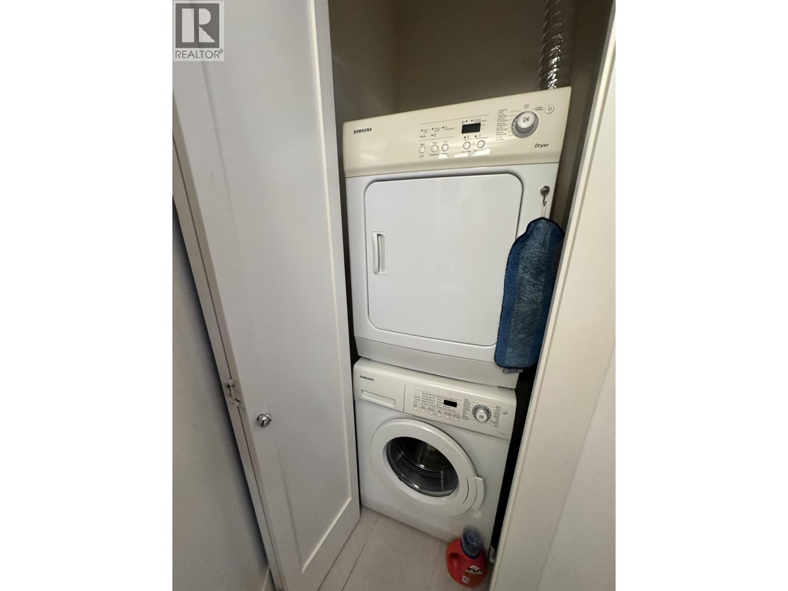 A washing machine and dryer in a small laundry room.