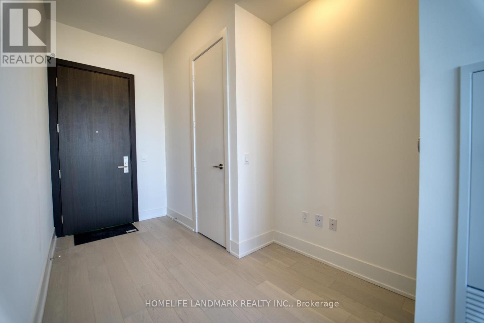 A room with a black door and a white door.