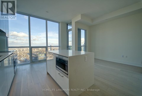 A modern kitchen with a view of the cityscape.