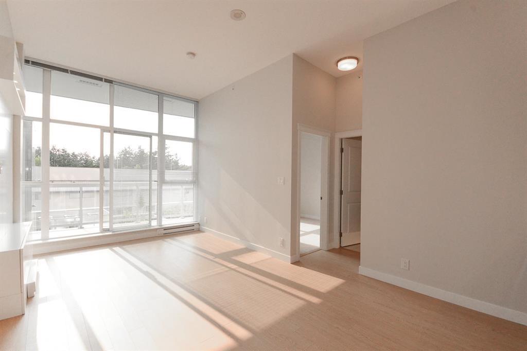 A room with a large window and a door.