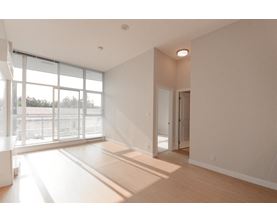 A room with a large window and a door.