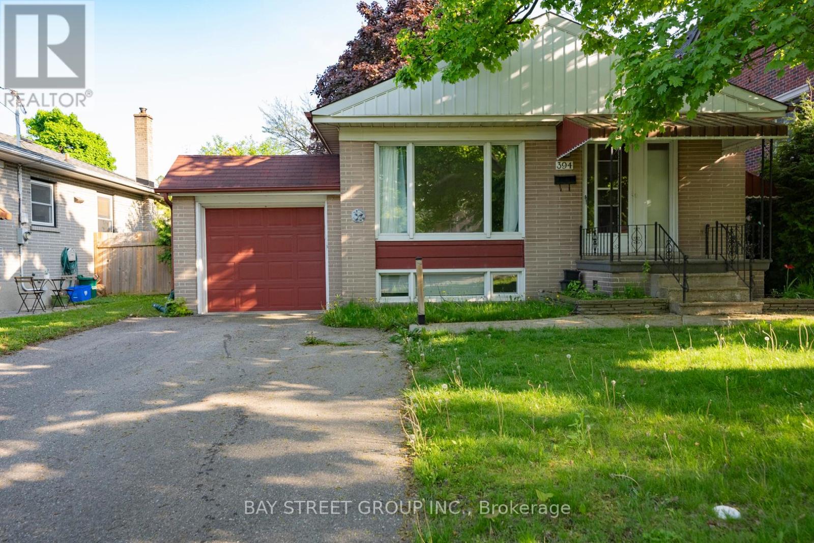 A house with a red garage door is for sale.