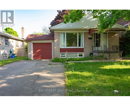 A house with a red garage door is for sale.