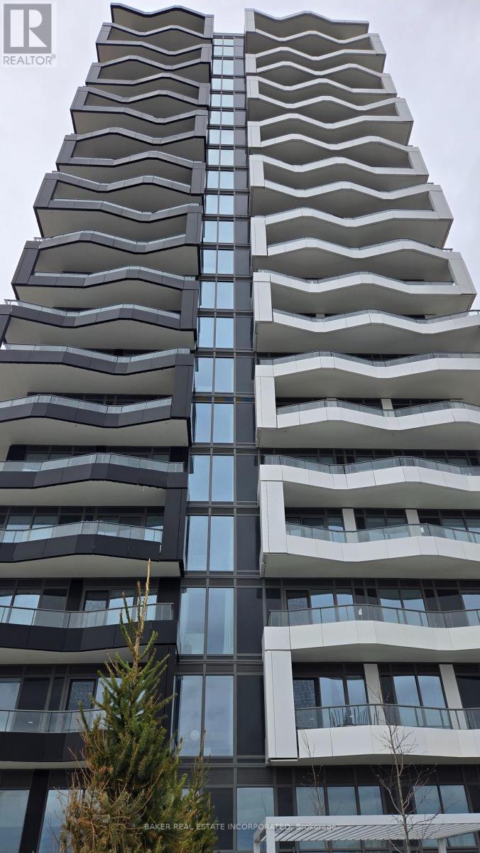 A tall residential building with balconies on each floor.