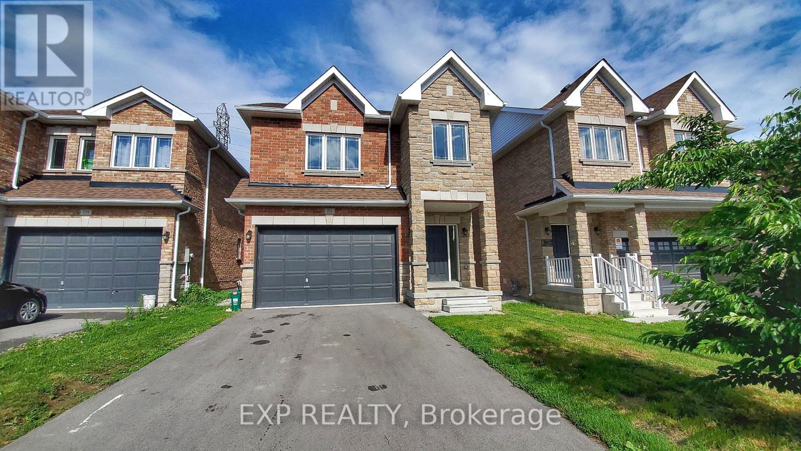 A large, multi-level house with a driveway in front.