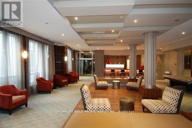 A living room with red chairs and a white ceiling.