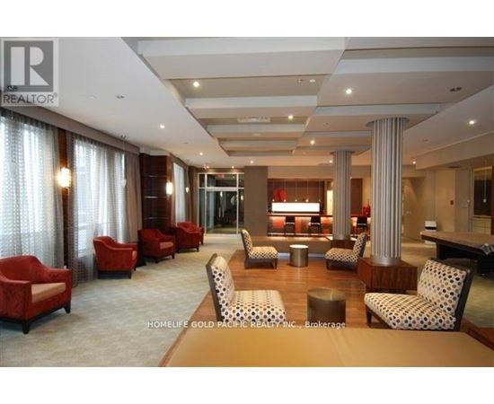 A living room with red chairs and a white ceiling.