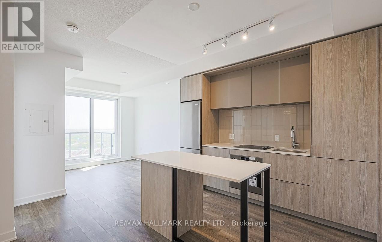 A kitchen with a table and chairs in the middle of the room.