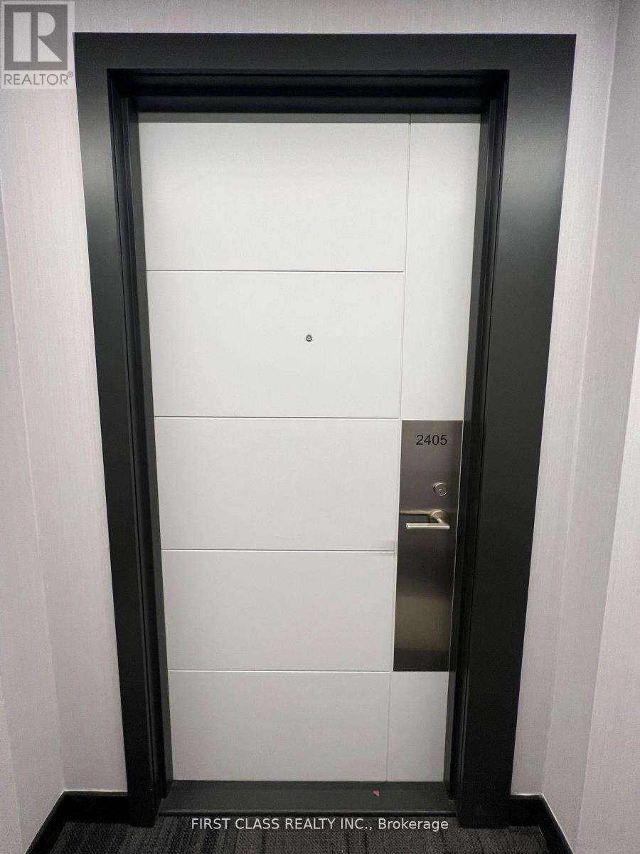 A door with a sign that says First Class Realty Inc Brokerage.