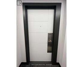 A door with a sign that says First Class Realty Inc Brokerage.