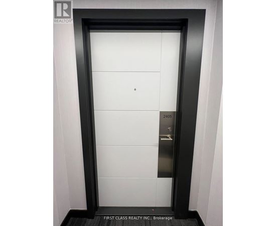 A door with a sign that says First Class Realty Inc Brokerage.