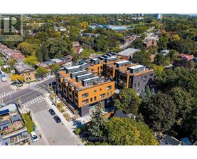 A real estate photographer has captured an aerial view of a modern apartment complex.