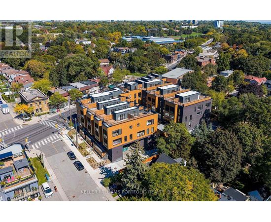 A real estate photographer has captured an aerial view of a modern apartment complex.