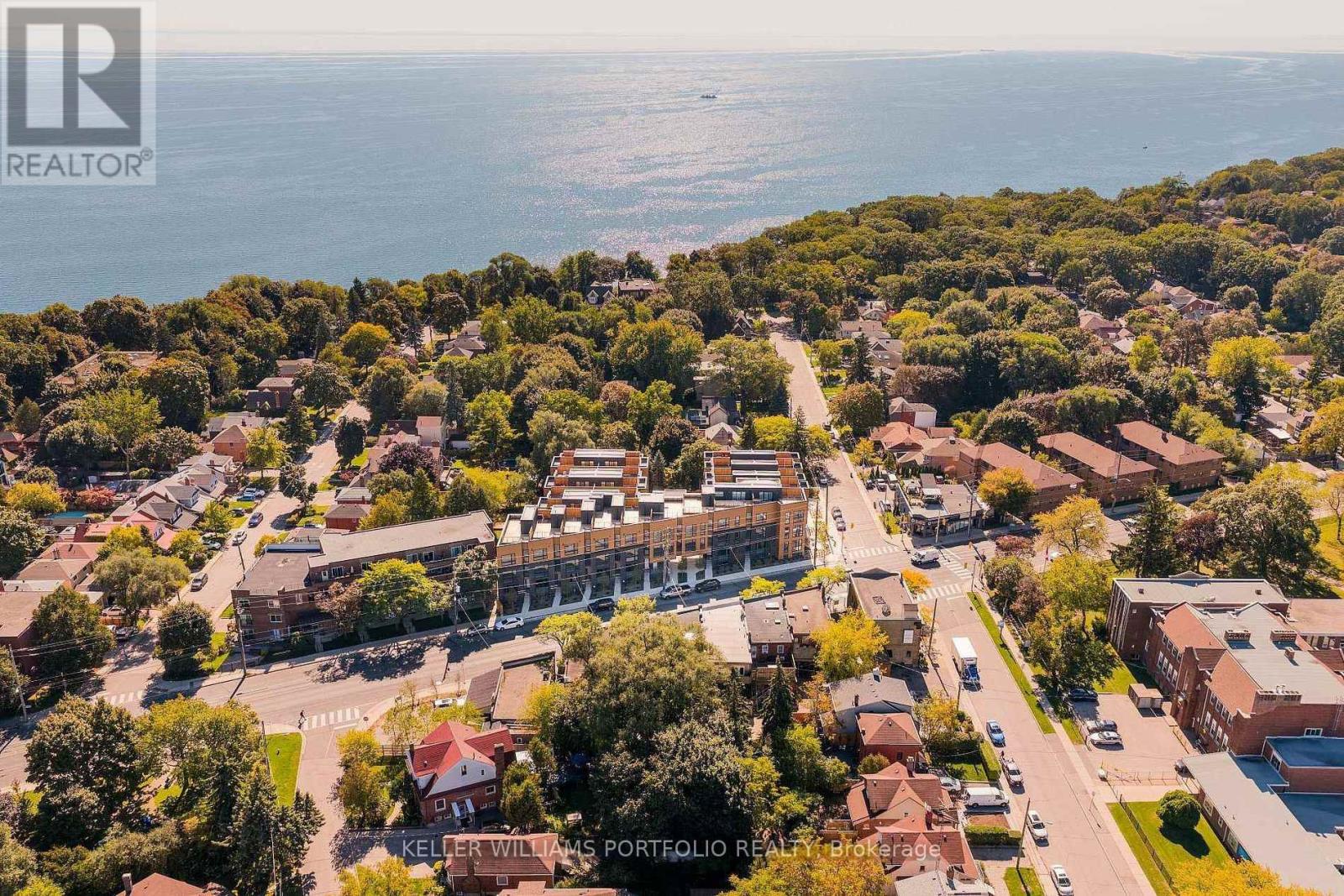 A bird's eye view of a residential area with a sign that reads "Keller Williams Portfolio Realty".