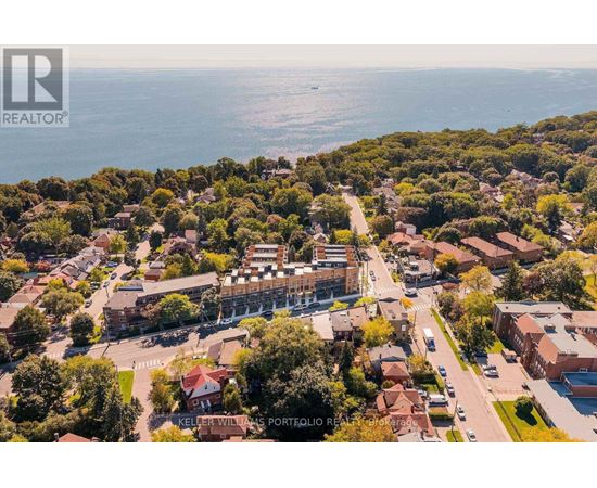 A bird's eye view of a residential area with a sign that reads "Keller Williams Portfolio Realty".