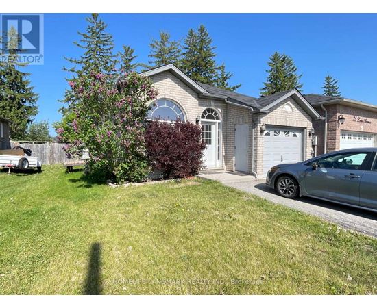 A house with a white garage door and a car parked in front.