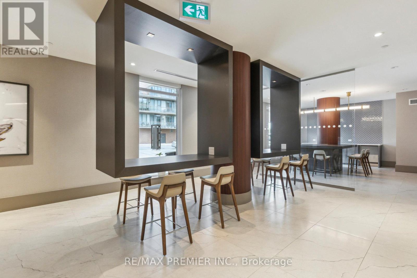 A dining area with a table and chairs in a modern setting.