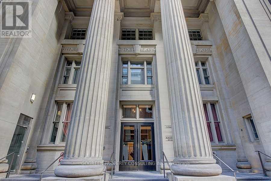 A building with a large entrance and pillars.