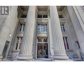 A building with a large entrance and pillars.