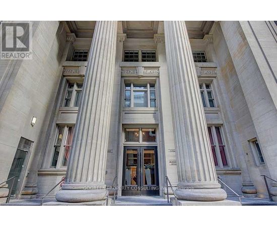 A building with a large entrance and pillars.