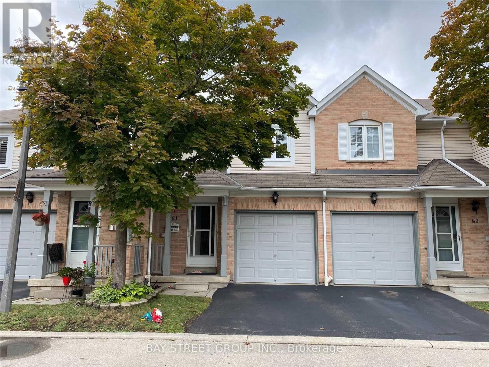 A two-story house with a garage is shown in the image.