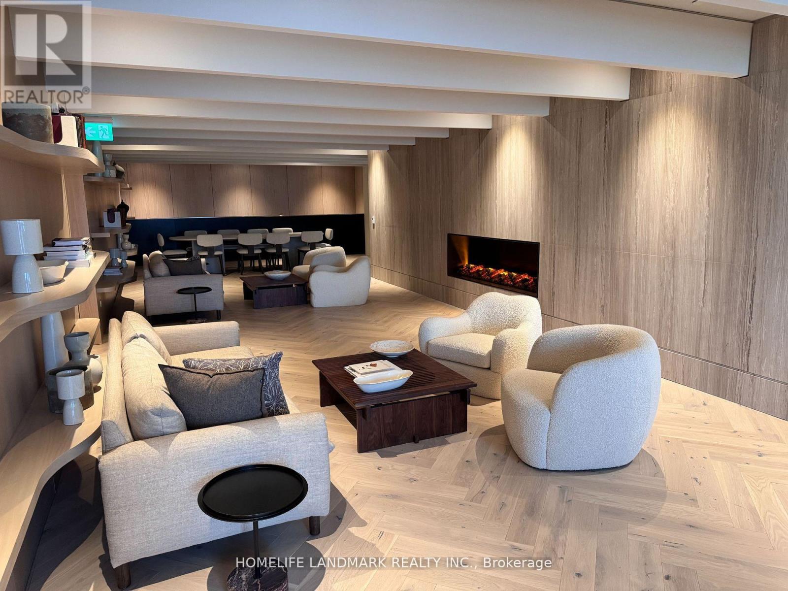 A modern living room with a fireplace and comfortable seating.