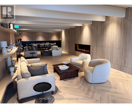 A modern living room with a fireplace and comfortable seating.