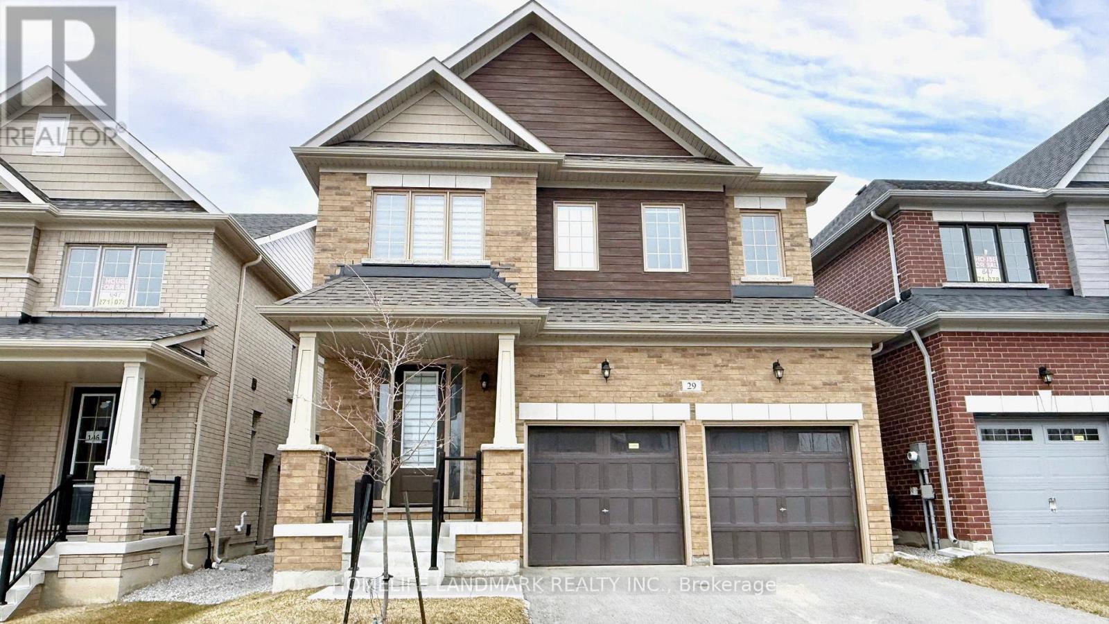 A large house with a garage is for sale.