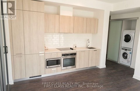 A kitchen with wooden cabinets and appliances.