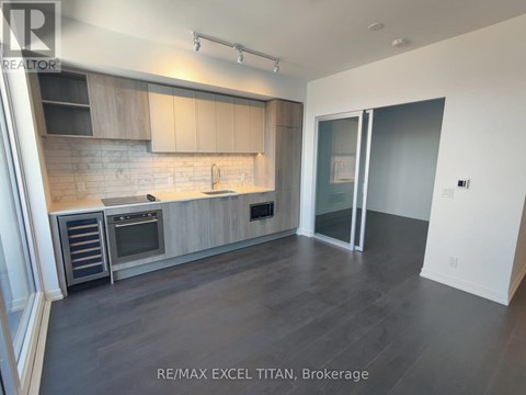 A modern kitchen with RE/MAX EXCEL TITAN, Brokerage logo.