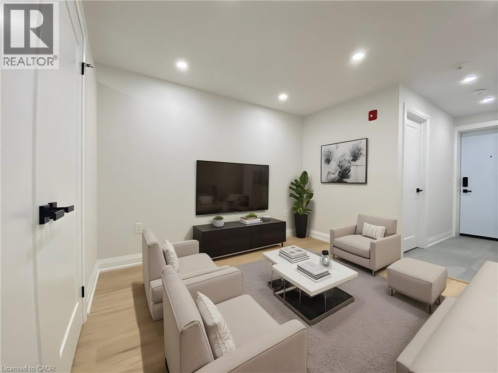 A living room with a flat screen TV and a coffee table.