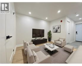 A living room with a flat screen TV and a coffee table.