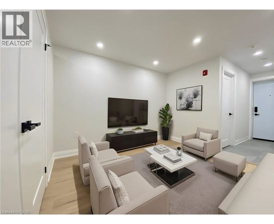 A living room with a flat screen TV and a coffee table.