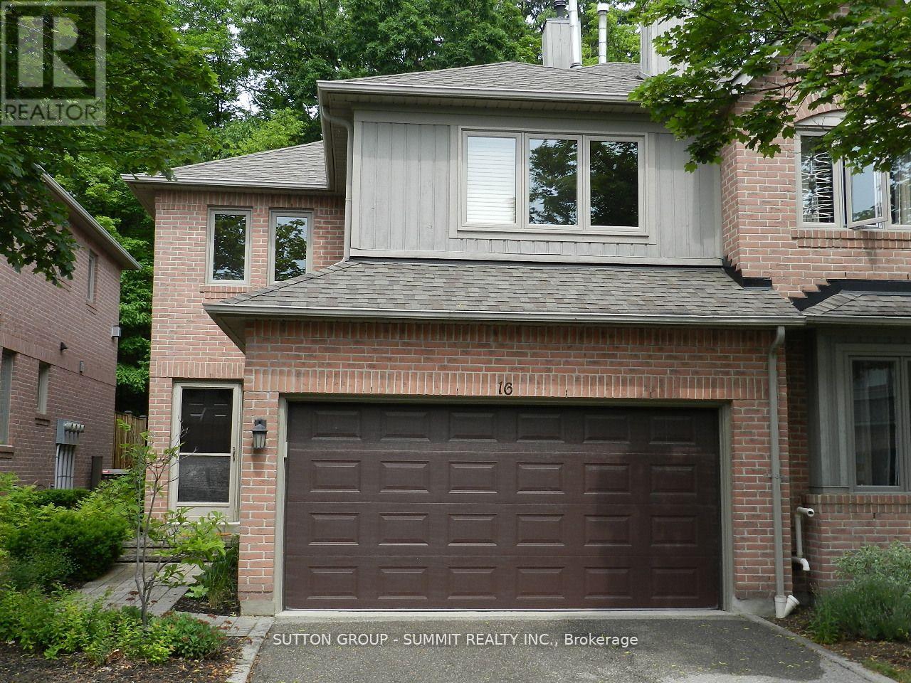 A house with a brown garage door is for sale.