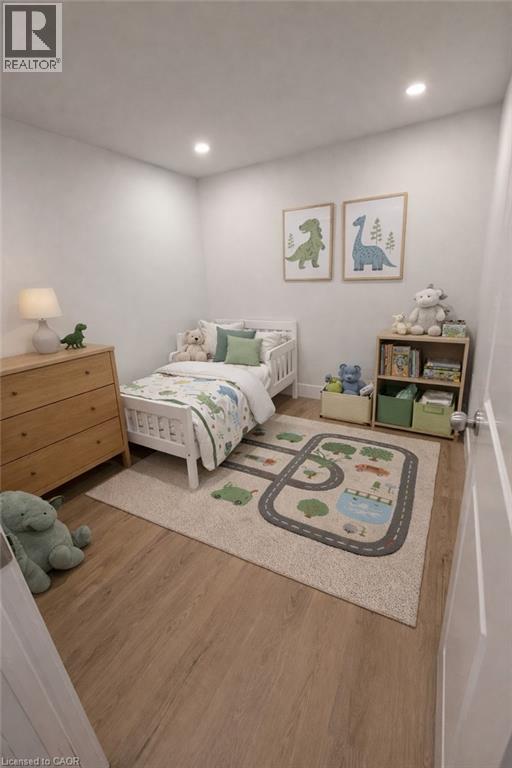 A child's bedroom with a white bed, a wooden dresser, and a rug with a road design on it.