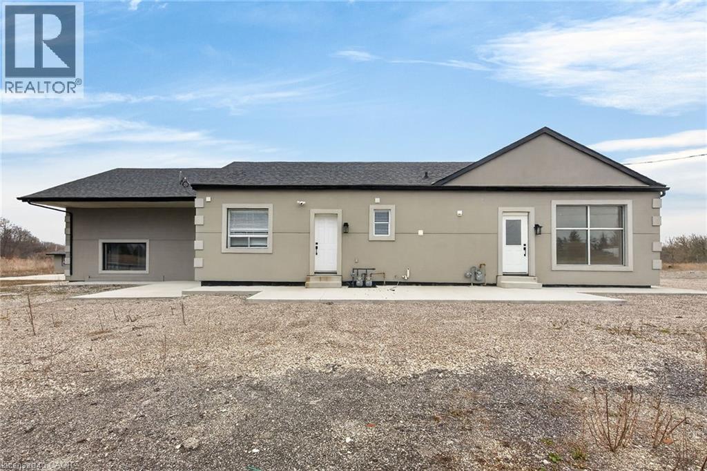 A house with a black fence in front of it.