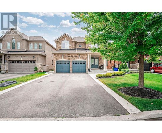 A large house with a driveway in front of it.