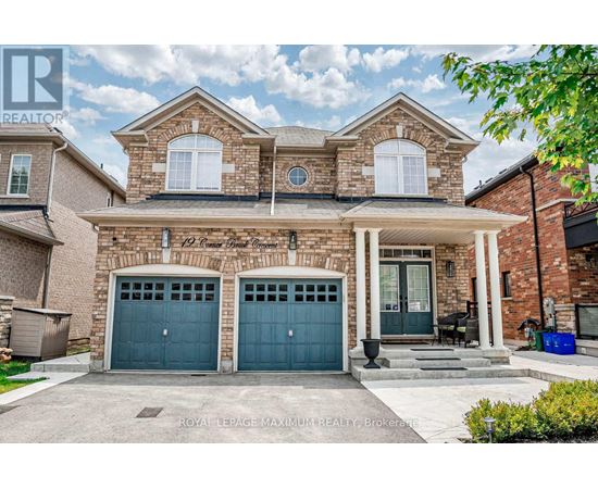 A two-story house with a brick facade and two garage doors.