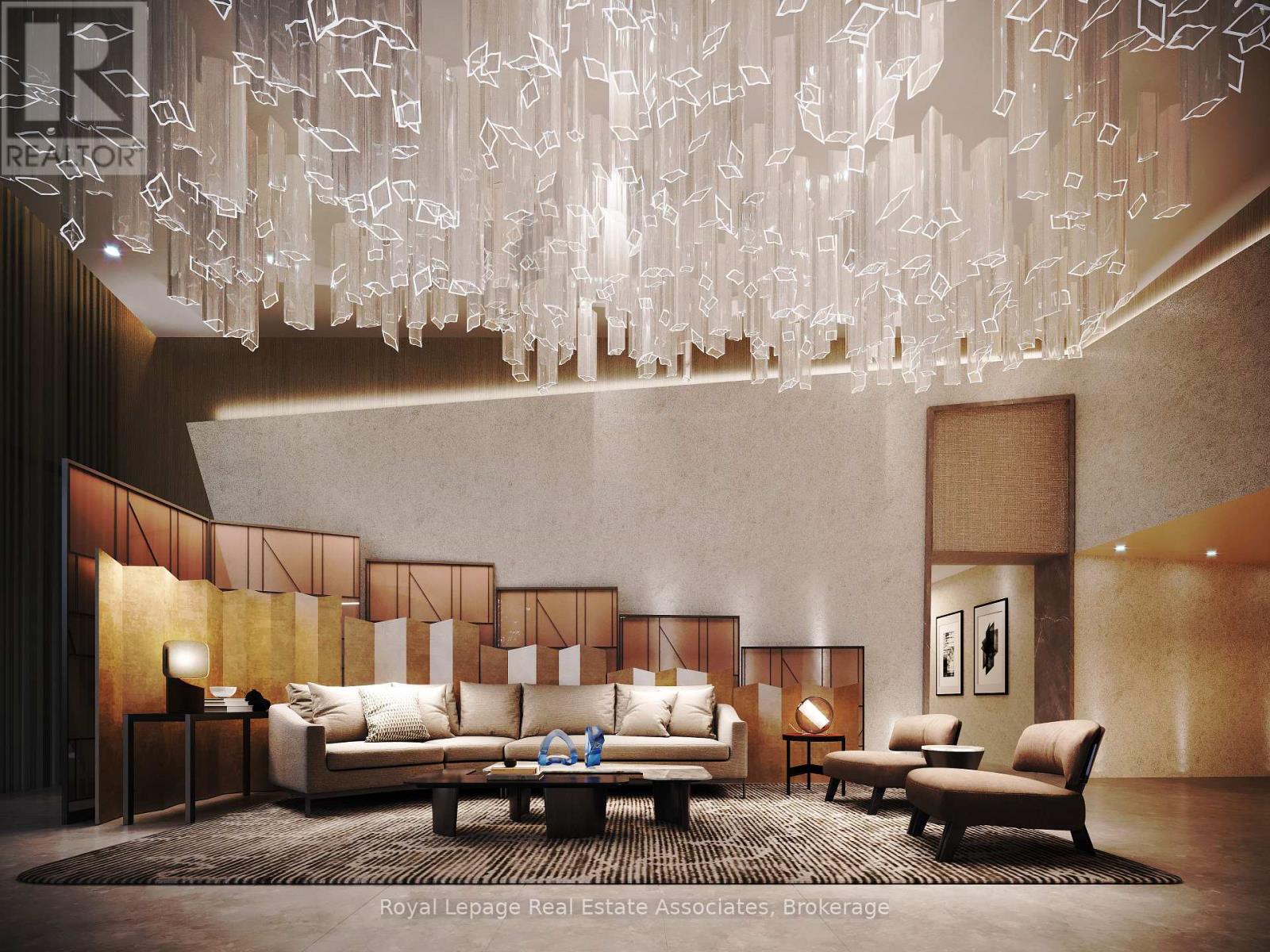 A modern living room with a large chandelier and a sofa set.