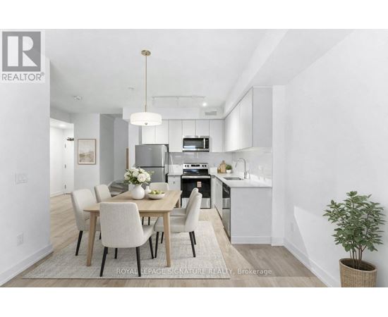 A modern kitchen with a dining table set for four.