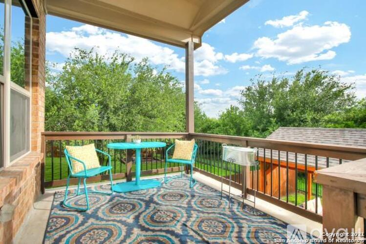 A patio with a table and chairs is shown.