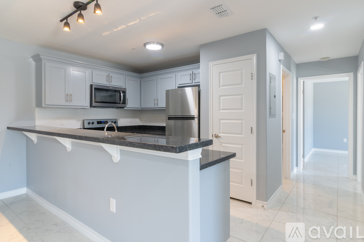 A kitchen with a countertop and cabinets.