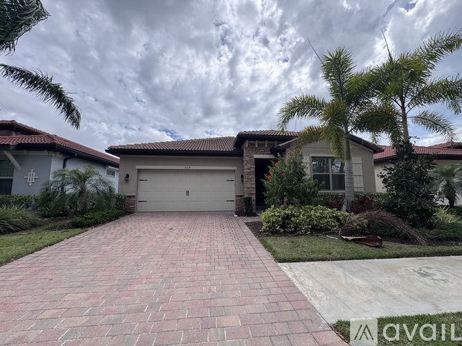 A house with a driveway in front of it.