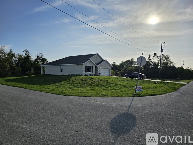 A house with a sign in front of it.