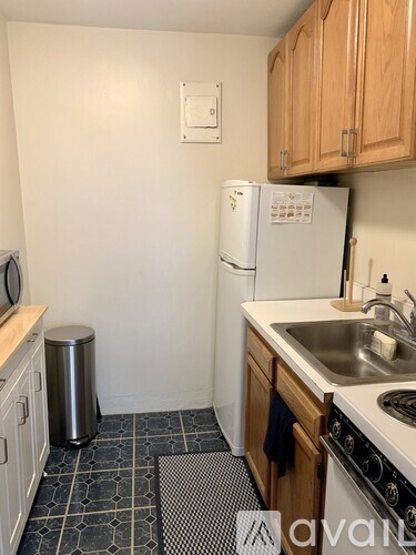 A kitchen with a white fridge and a white microwave.